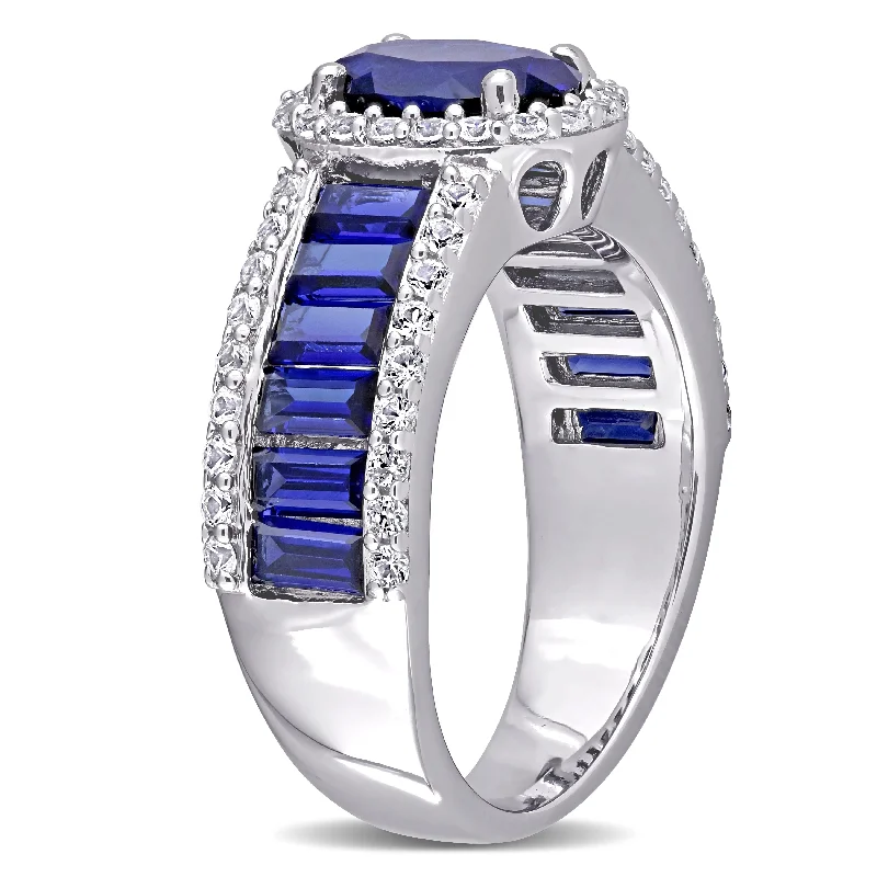 Oval & Baguette-cut Created Blue and White Sapphire Halo Engagement Ring in Sterling Silver by Miadora